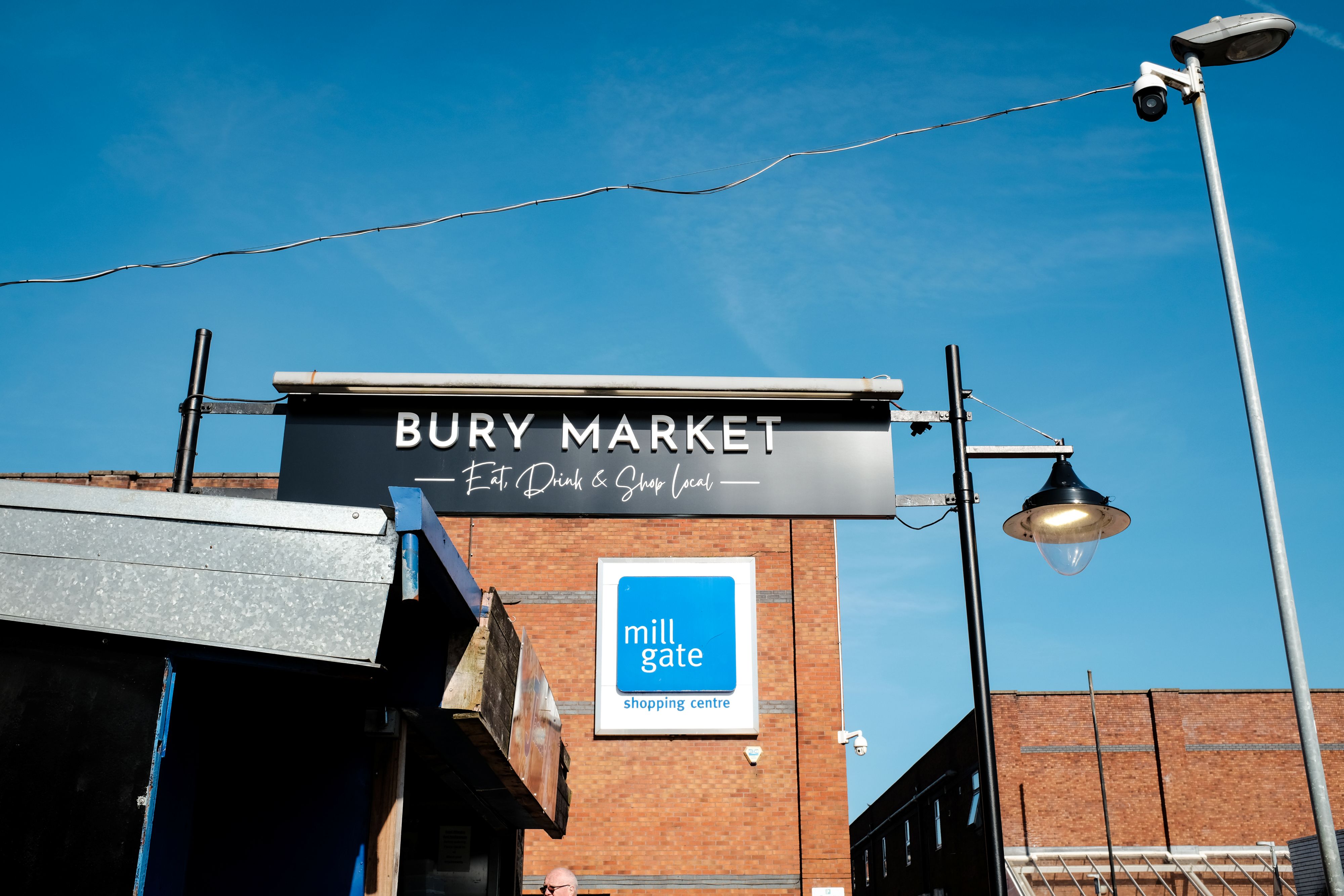 Exterior of Bury Market, the sky is blue